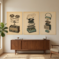 A three-panel wall art set featuring vintage exploded diagrams of a reel-to-reel recorder, a turntable, and a portable radio, displayed above a mid-century modern wooden sideboard in a styled living room.